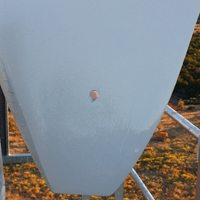 A wind turbine in need of rotor blade repair due to a lightning strike