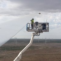 a blade wind services blade tech carrying out rotor blade repair to a wind turbine